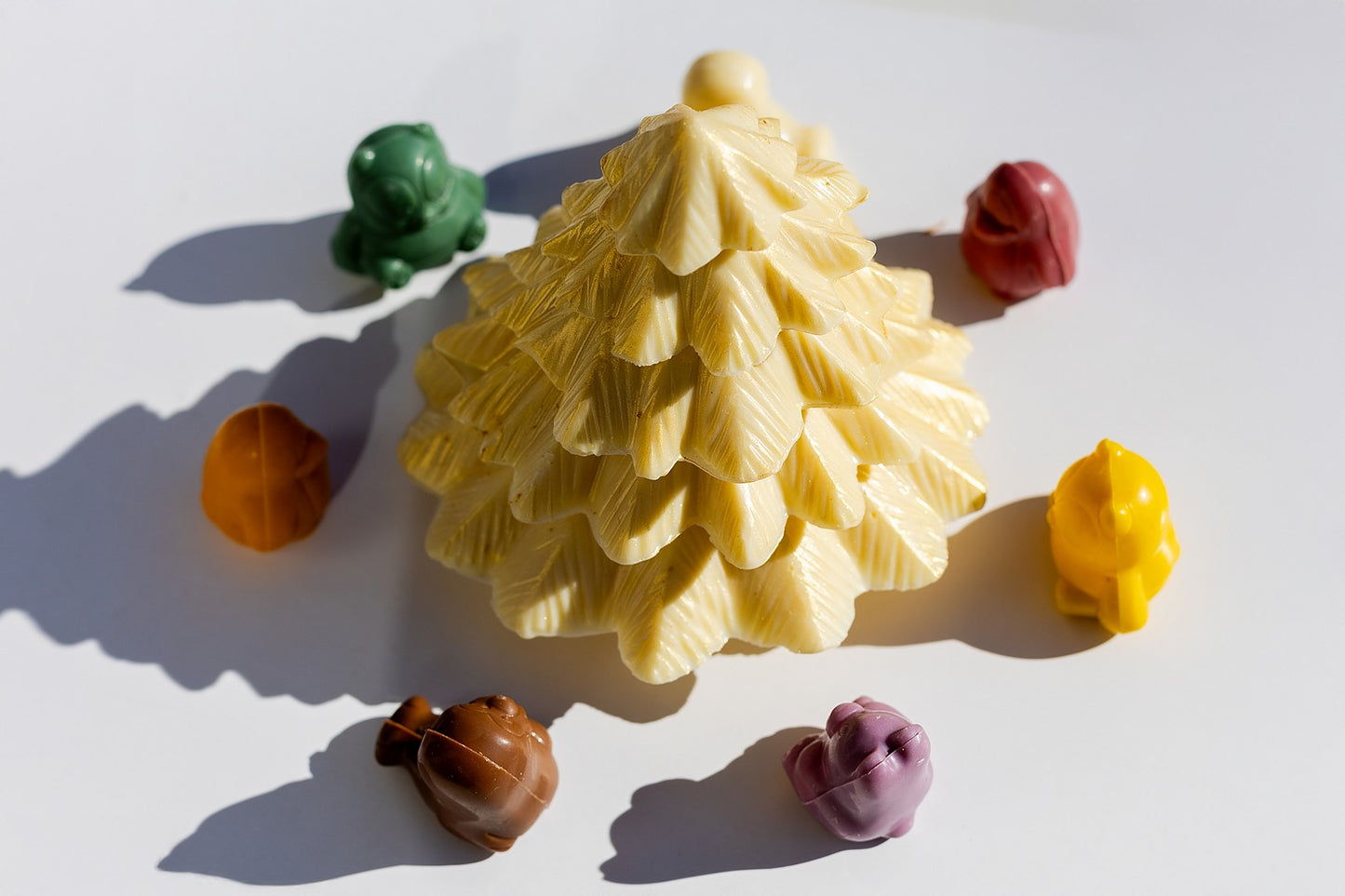 Handcrafted chocolate Christmas tree with five stacked layers of chocolate, designed as a festive holiday chocolate gift.