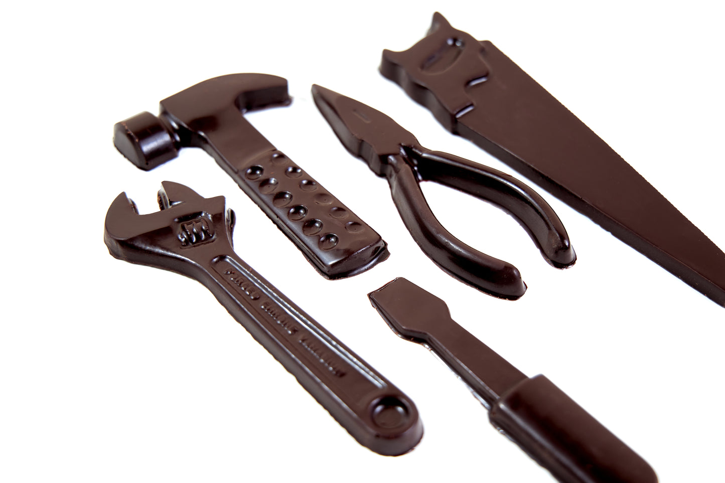 Chocolate tools set crafted from dark, milk, white, or ruby chocolate, shaped like realistic workshop tools and presented as a unique artisan chocolate gift