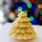 Handcrafted chocolate Christmas tree with five stacked layers of chocolate, designed as a festive holiday chocolate gift.