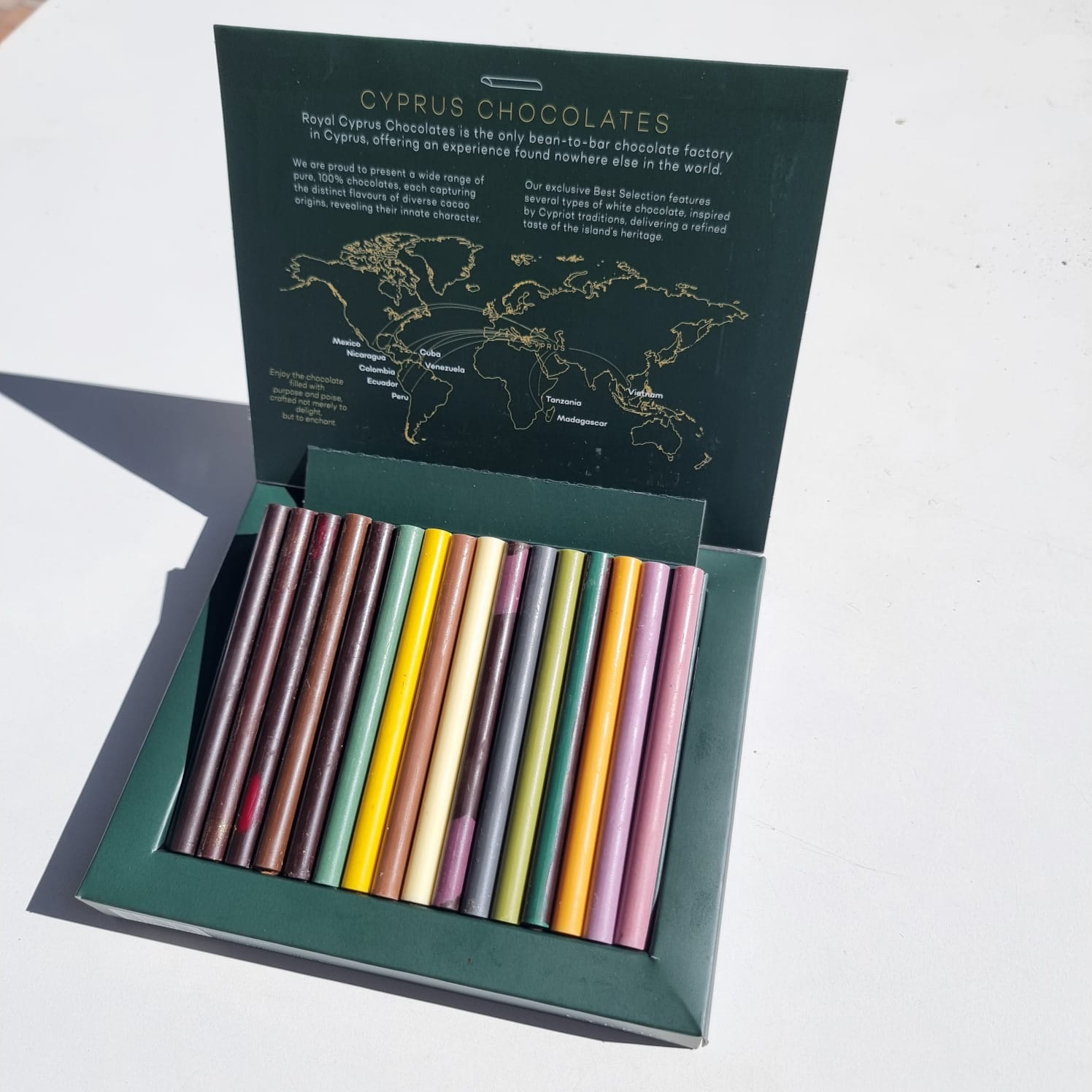 Open Best Selection chocolate set revealing 16 bite-sized chocolate sticks with unique flavours, including white, milk, and dark chocolates from Love and Classic collections