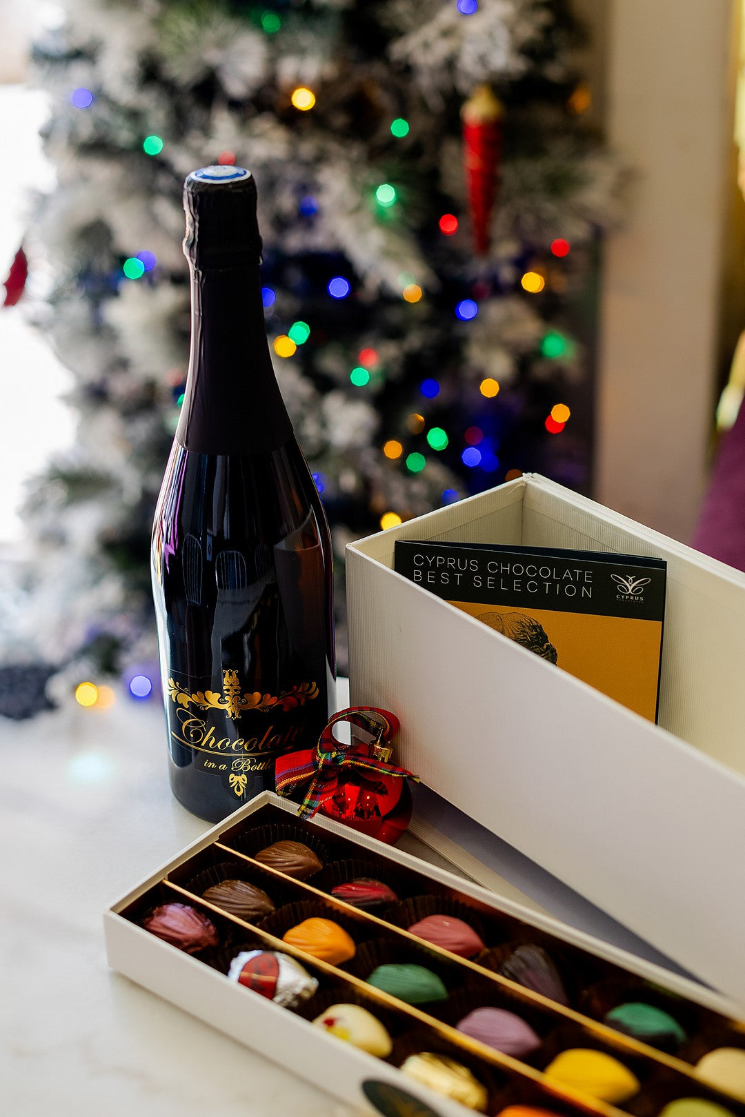 Luxury gift box featuring Exclusive Chocolate Wine Box set with 21 chocolate petals, perfect for celebrations, made in Cyprus
