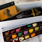 Luxury gift box featuring Exclusive Chocolate Wine Box set with 21 chocolate petals, perfect for celebrations, made in Cyprus