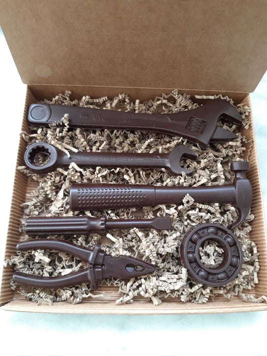 Chocolate tools set crafted from dark, milk, white, or ruby chocolate, shaped like realistic workshop tools and presented as a unique artisan chocolate gift